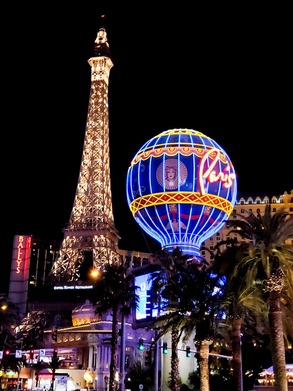 Night-time city architecture with illuminated towers and evening street light