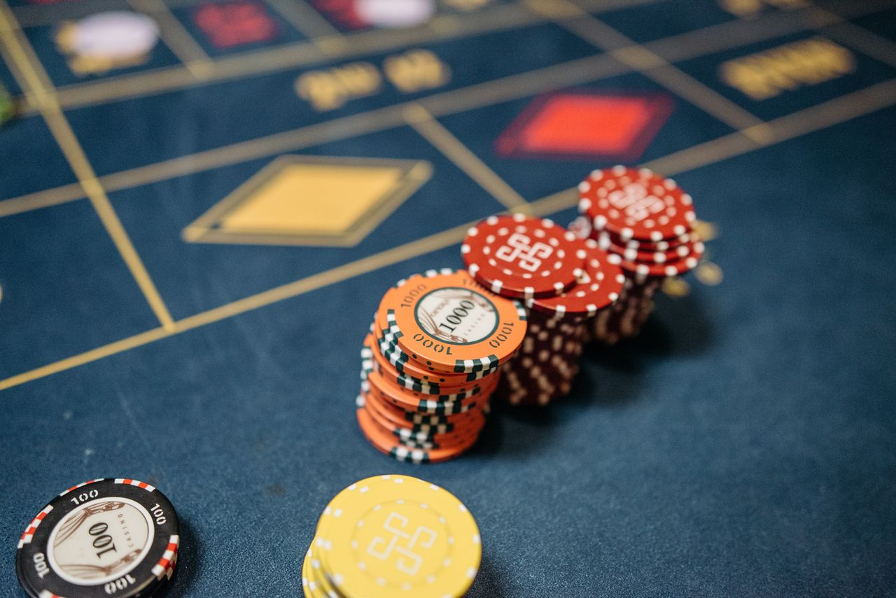 Close view of orange and red chips on a navy table